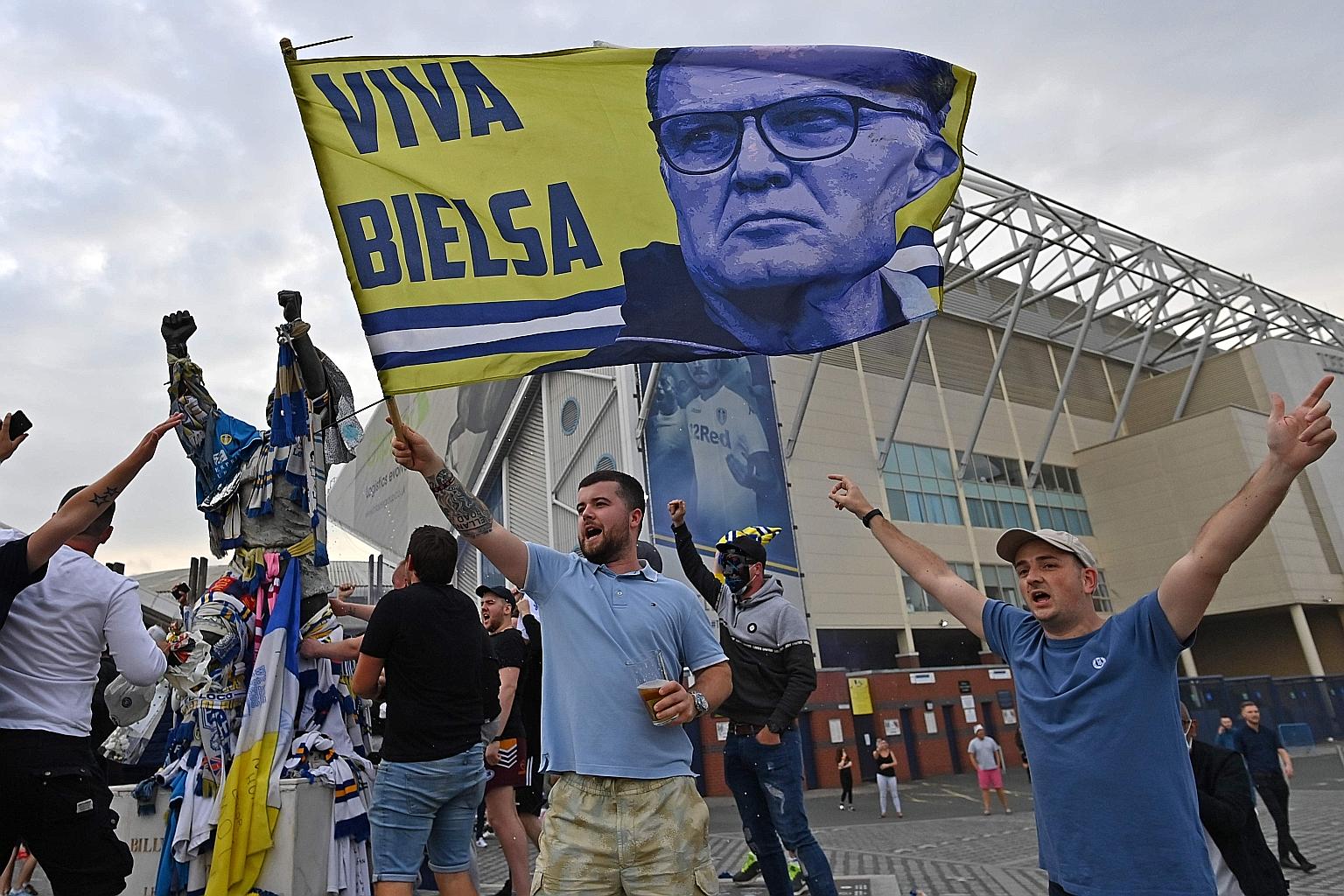 Leeds United fans gathering outside their Elland Road ground to celebrate the club's return to the Premier League after 16 years. PHOTO: AGENCE FRANCE-PRESSE
