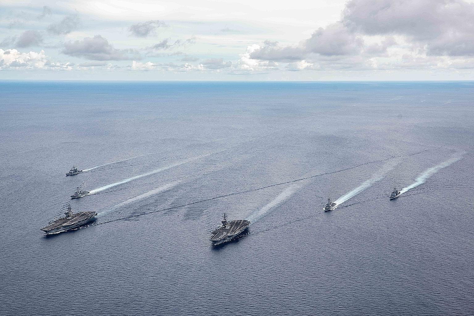 US navy vessels during a drill in the South China Sea on July 6. The US last week hardened its position, saying it would back countries in the region that challenge Beijing's claim to about 90 per cent of the strategic waterway.