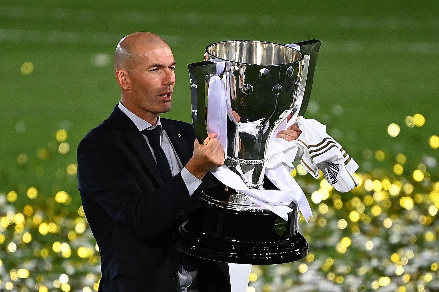 Real Madrid boss Zinedine Zidane lifting the La Liga trophy at the Alfredo di Stefano Stadium last Thursday. The Frenchman needed just 209 matches in charge to win 11 trophies.