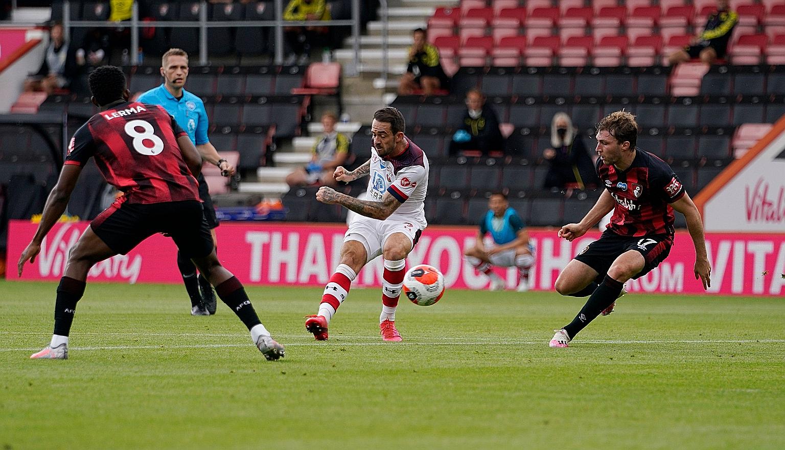 Saints' Danny Ings (centre) scoring his 21st Premier League goal of the season against Bournemouth yesterday. He is second on the top scorers' list.