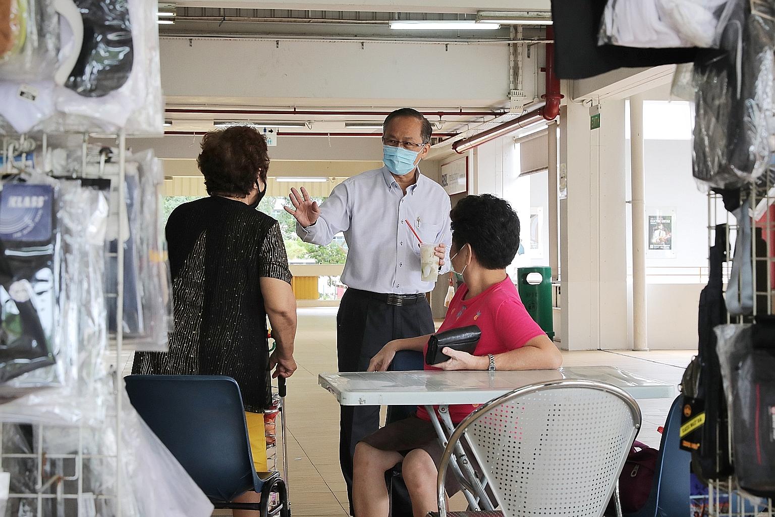 Mr Lim Biow Chuan, MP for Mountbatten SMC, greeting residents at Old Airport Road Food Centre last Wednesday. He is on a first-name basis with many people in the neighbourhood. ST PHOTO: GAVIN FOO
