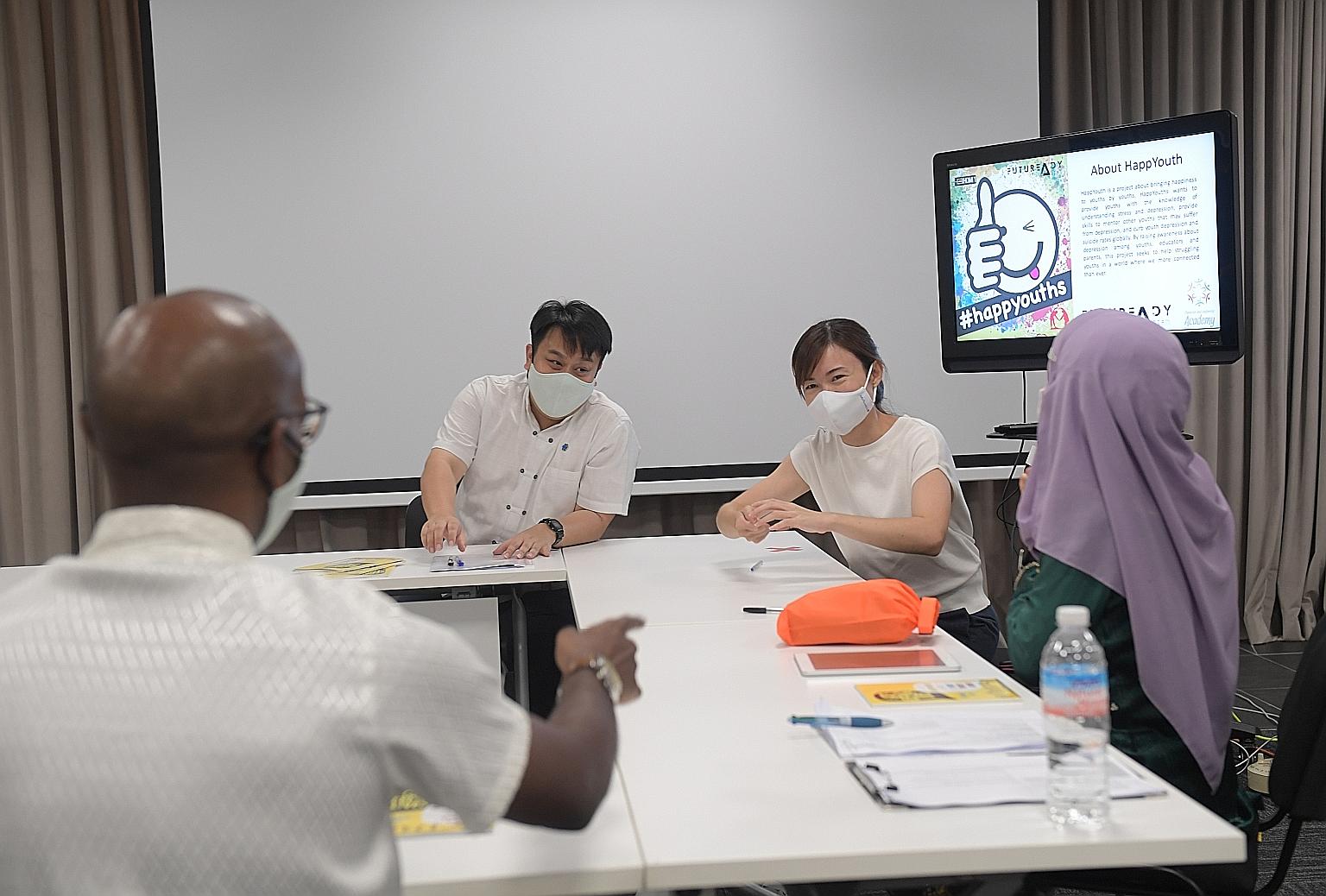 MacPherson MP Tin Pei Ling (third from left) discussing the HappYouth programme with youth leaders from the Character & Leadership Academy at the 12th Global Youth Leaders Summit last Saturday. ST PHOTO: ALPHONSUS CHERN