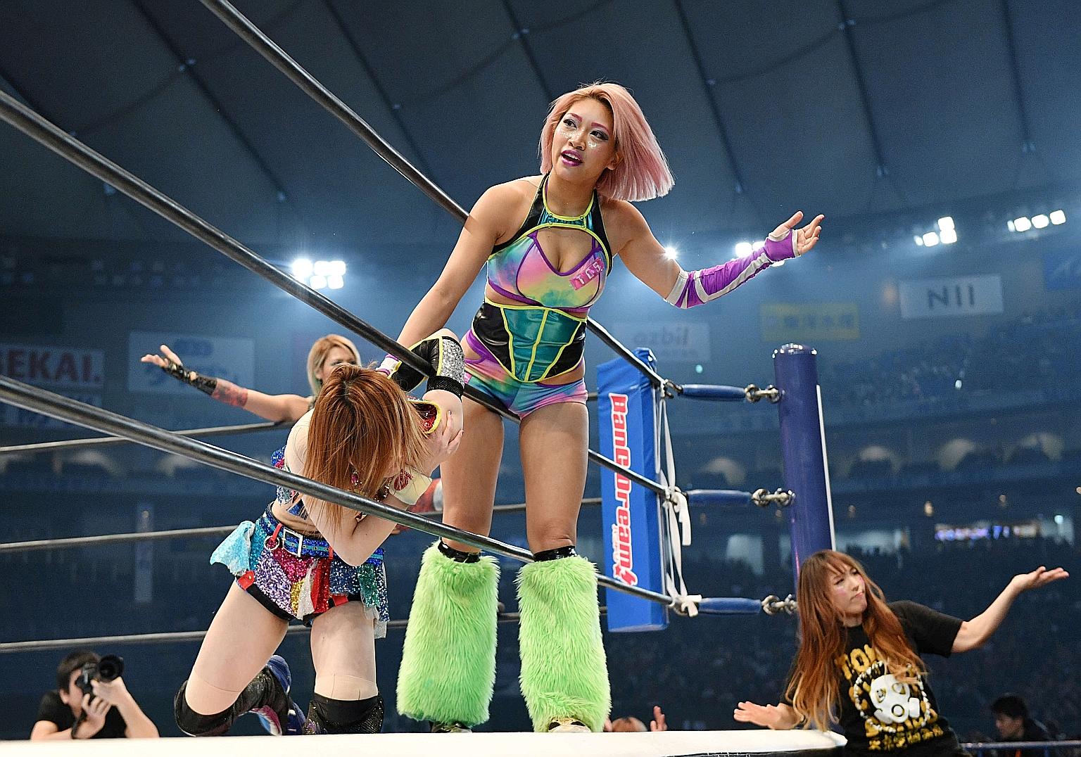 The death of professional wrestler Hana Kimura (left, with pink hair) has sparked debate over cyber bullying in Japan. Network Fuji TV has cancelled the current season of Terrace House and has not said whether the show will return.