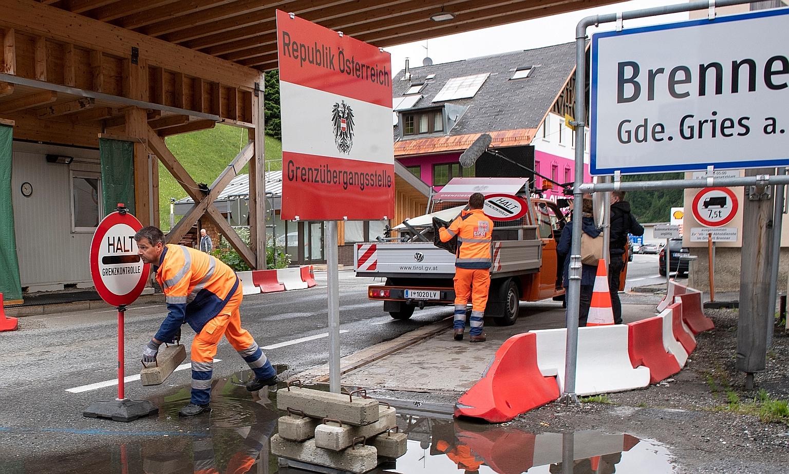 Workers dismantling a temporary checkpoint in Brenner, Austria, last month as the border between Austria and Italy reopened amid the coronavirus pandemic.