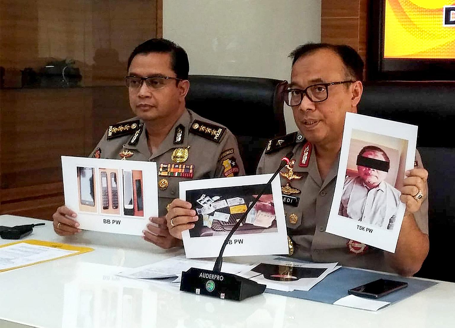 Indonesian police with photos of Para Wijayanto and various seized items at a press conference in Jakarta this month.