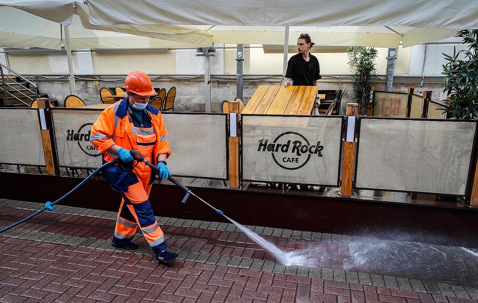 A worker disinfecting a street in Moscow on Monday. Russia has reported more than 780,000 coronavirus cases, the fourth-largest case tally in the world.