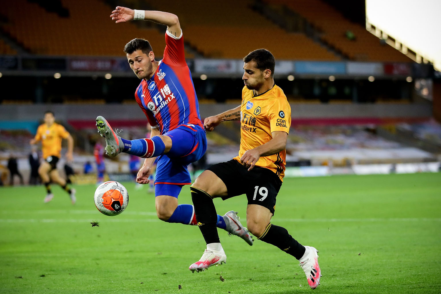 Crystal Palace's Joel Ward (far left) challenging Wolves defender Jonny for the ball during their English Premier League match at Molineux on Monday. Jonny sealed the 2-0 win in the 68th minute after Daniel Podence opened the scoring in the first hal