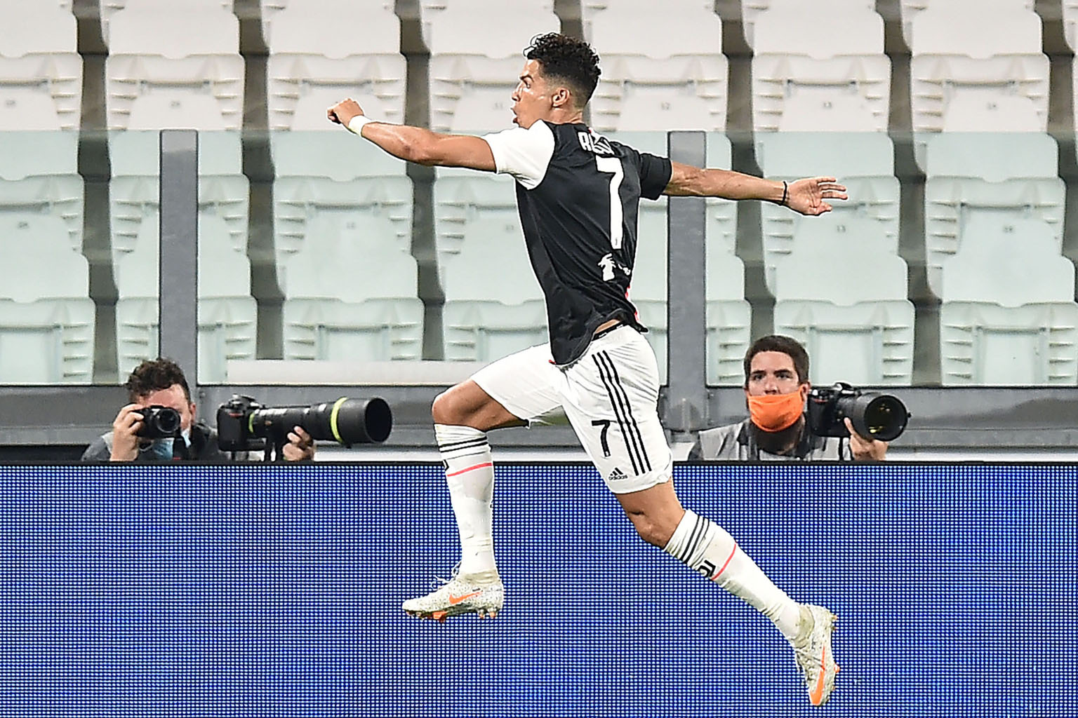 Cristiano Ronaldo celebrating opening the scoring from the penalty spot against Lazio. The Portuguese forward is poised to win his second Scudetto with Juventus.