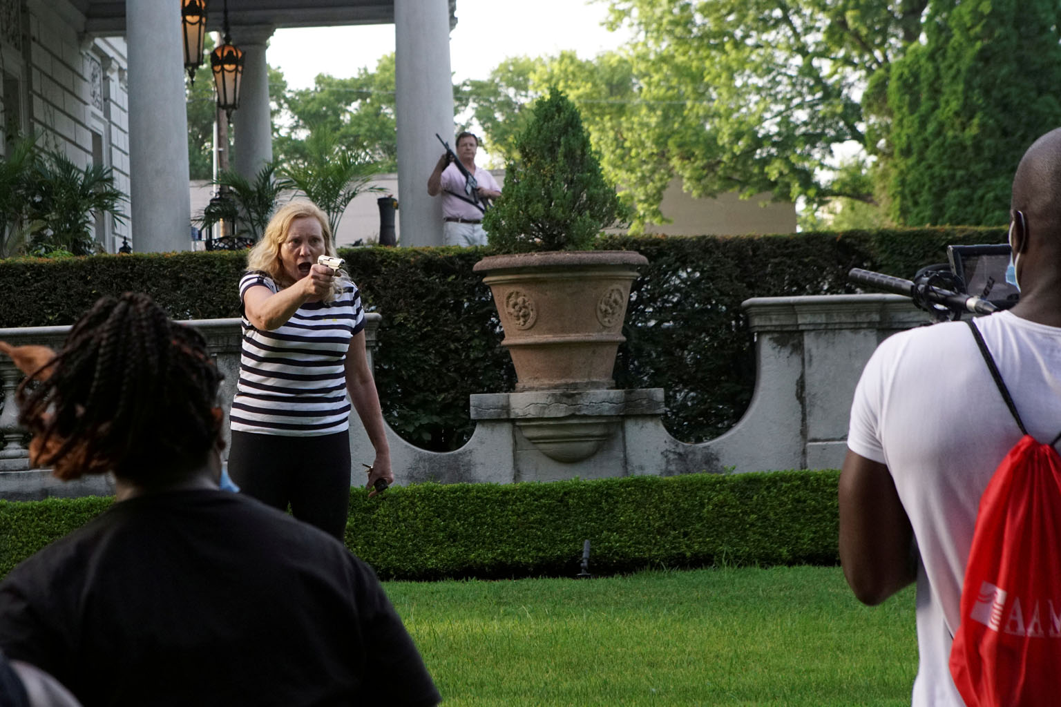 Patricia and Mark McCloskey drew firearms on anti-racism protesters as they marched down a private street outside their Missouri mansion. PHOTO: REUTERS