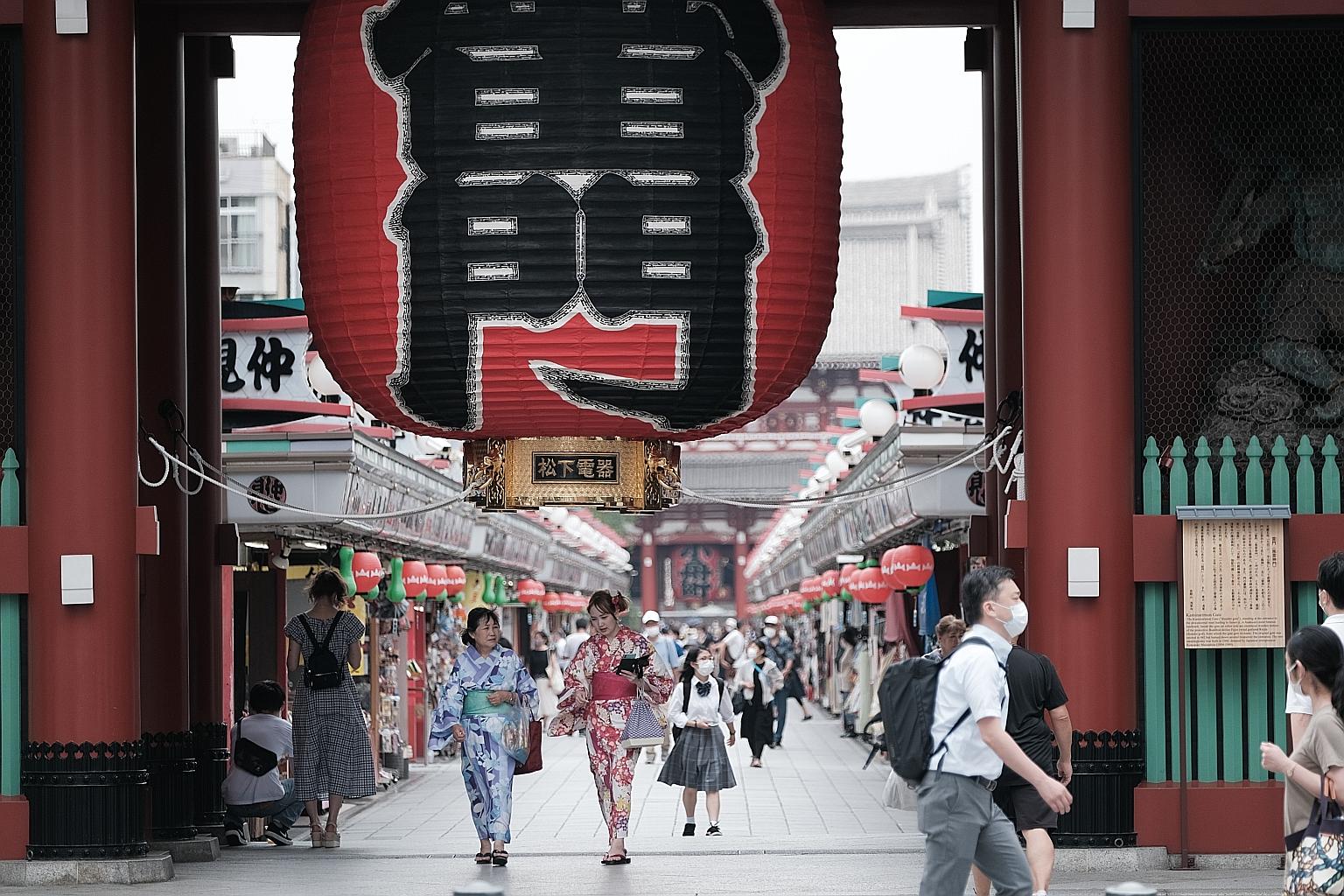 Visitors at the Sensoji temple in the Asakusa district of Tokyo yesterday. Tokyo's residents were cut off from promised travel subsidies while its businesses are set to miss out on tourists after the government's move to exclude the capital from the 