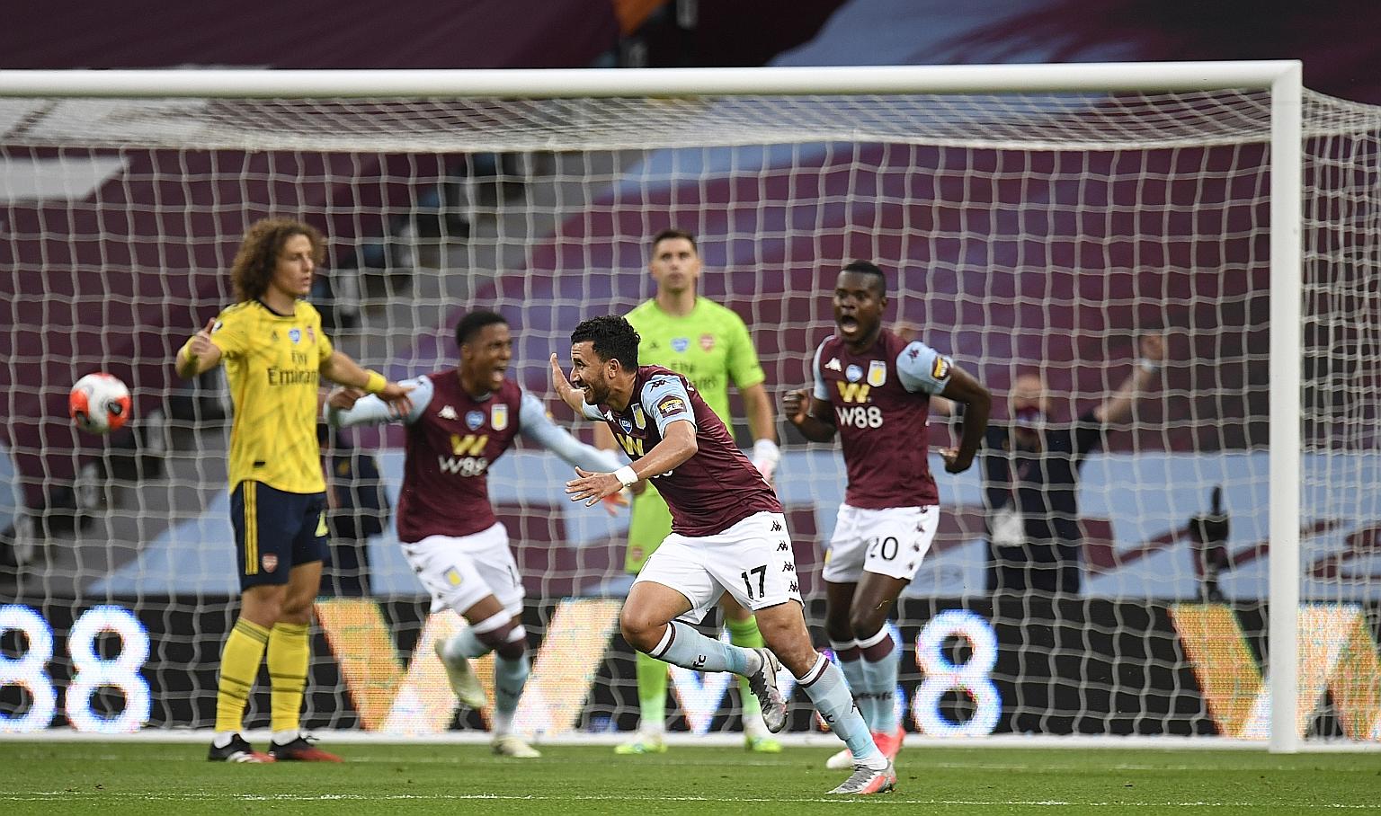 Aston Villa's Trezeguet wheeling away after sinking his shot into the Arsenal goal. The Egyptian's strike was the game's only goal, giving the relegation-threatened side a potentially priceless win over FA Cup finalists Arsenal at Villa Park.