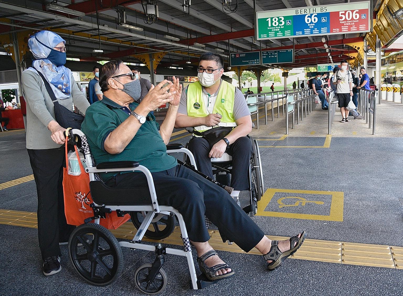 Wheelchair user Kishon Chong (right) gathering feedback from two bus commuters last Friday at Jurong East bus interchange. "This is a historic change," says the Public Transport Council chairman of Mr Chong's role as a customer experience and inclusi