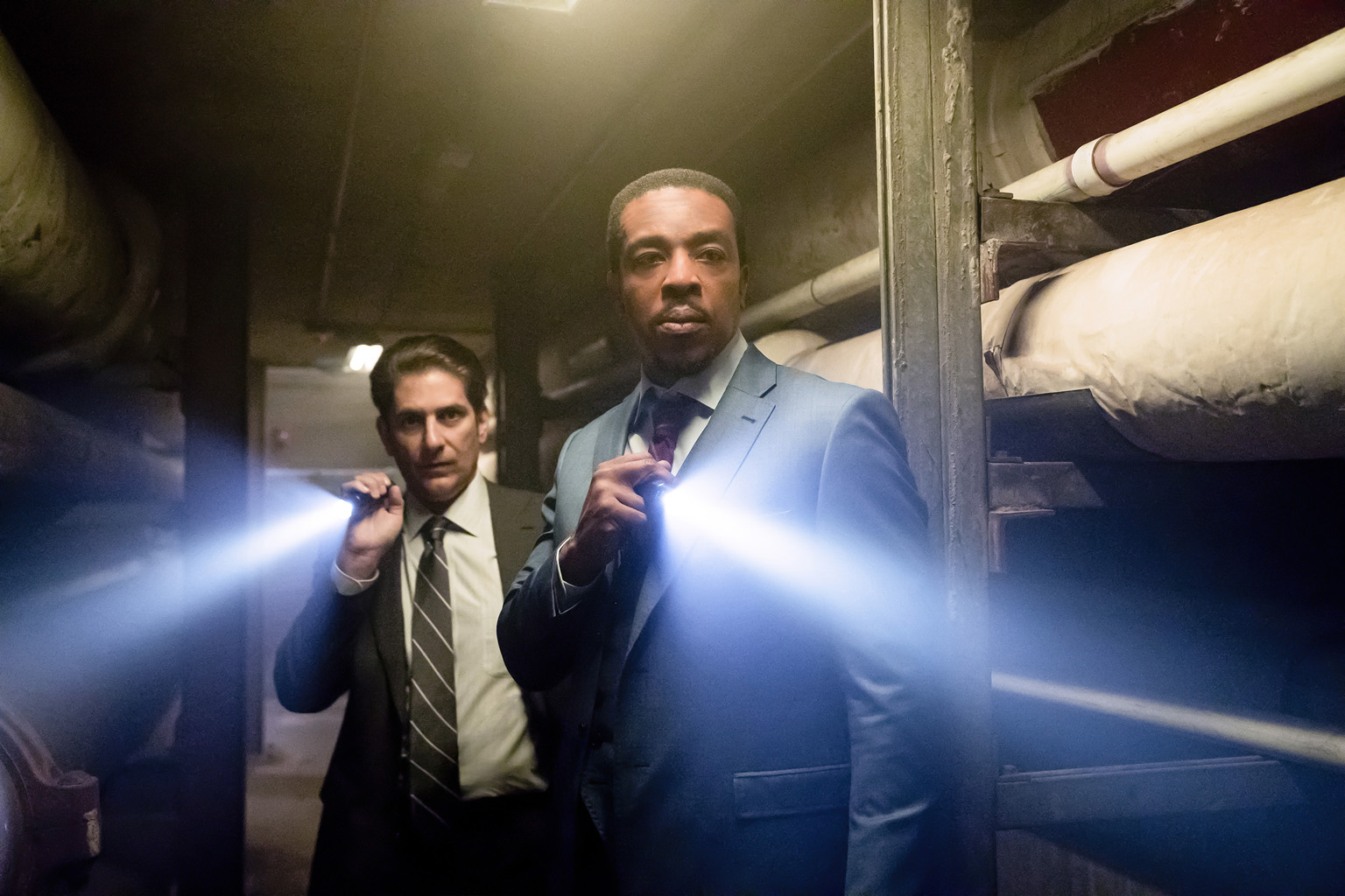 In a flashback scene in Lincoln Rhyme: Hunt For The Bone Collector, Lincoln Rhyme (Russell Hornsby, right) and Mike Sellitto (Michael Imperioli, left) were New York City detectives who investigated an infamous serial killer.