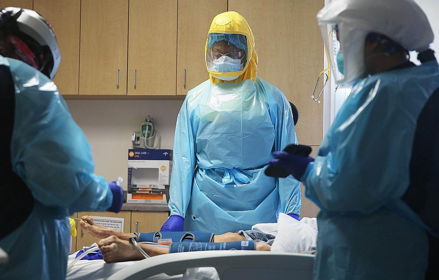 Clinicians attending to a Covid-19 patient in the intensive care unit of the El Centro Regional Medical Centre in Imperial County, California, on Tuesday. The overall tally of cases in the most populous US state rose by 12,112 on Wednesday to more th
