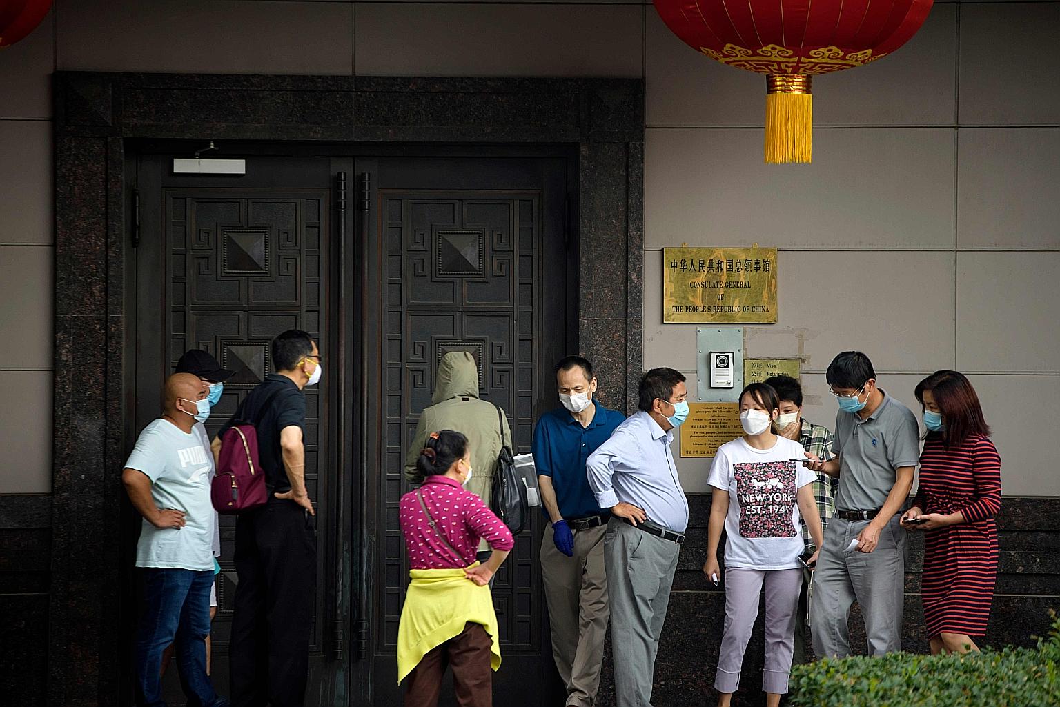 People seeking to talk to staff at the Chinese consulate in Houston, Texas, on Wednesday, when the US ordered its closure over commercial espionage and intellectual property theft from American firms and gave Chinese diplomats 72 hours to pack up.