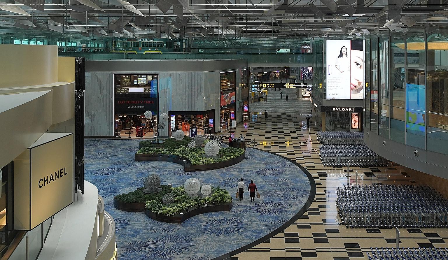 A near-empty transit area in Changi Airport Terminal 3 in June. Professor Teo Yik Ying of the Saw Swee Hock School of Public Health said at the ST webinar that people are exposed to various factors beyond their control when they travel.