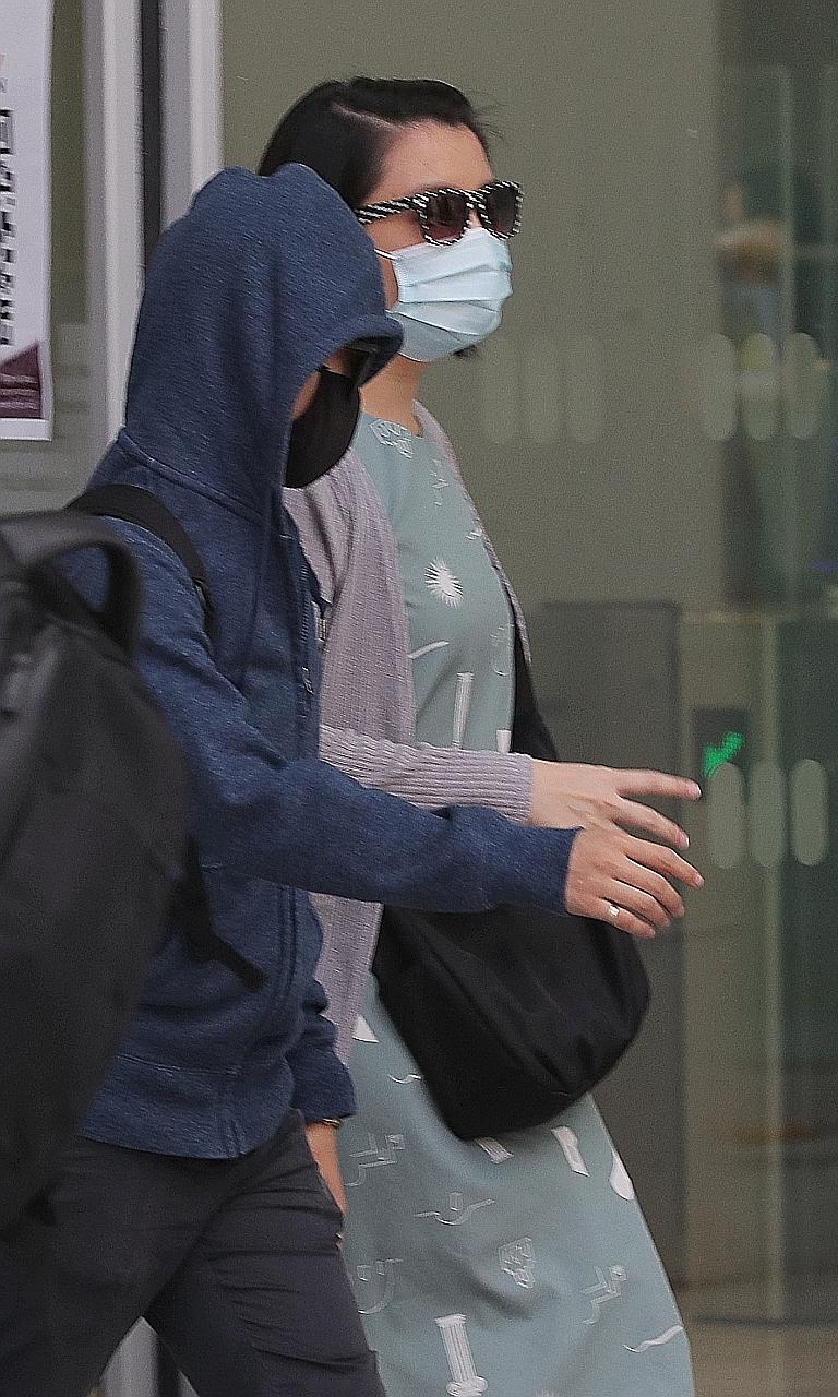 Cassie Ong Shi Hong (in green) was among five people who appeared in a district court yesterday over an unlawful gathering. She and the sole owner of a Sengkang flat are accused of allowing 16 others into their home on May 8, during the circuit break