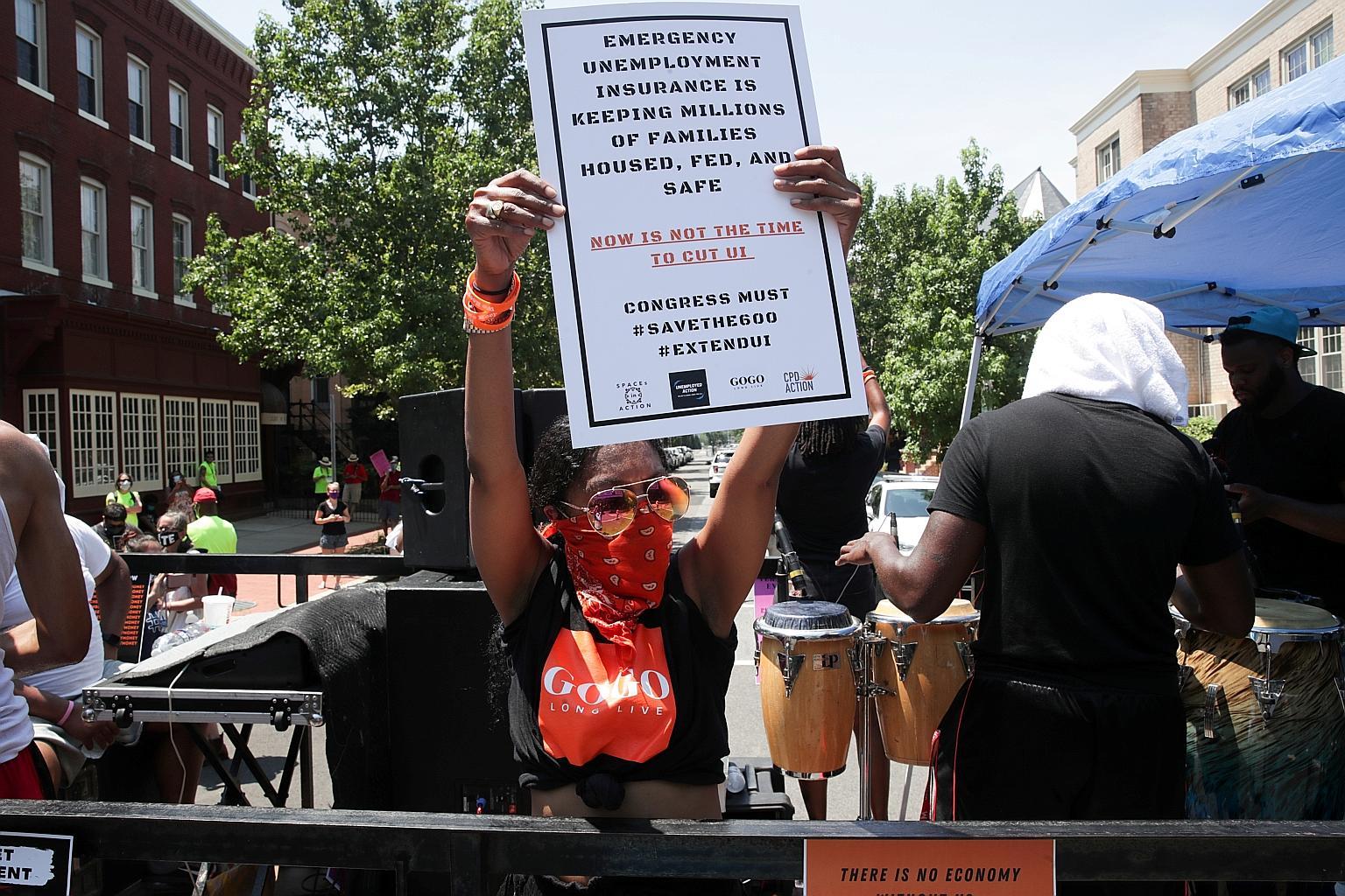 A demonstrator calling for the extension of Covid-19-related unemployment aid earlier this week on Capitol Hill in Washington. PHOTO: REUTERS