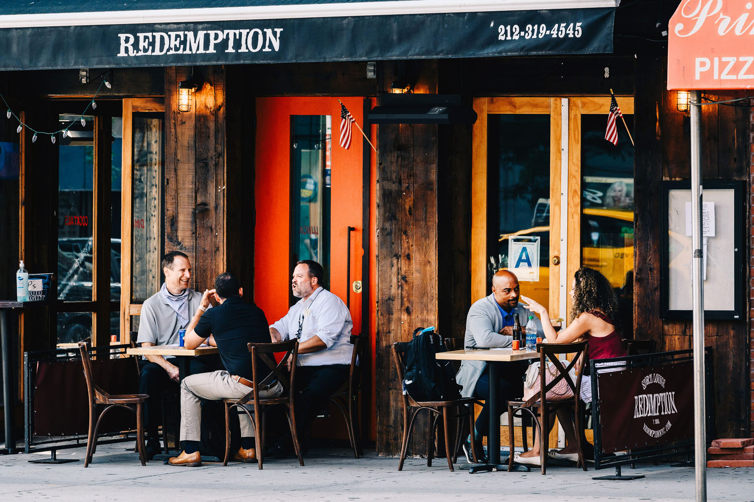 Customers at a bar in New York on Wednesday. As the lockdown eases, people have been seen flouting social distancing rules and gathering outside restaurants and bars sans masks. Though new cases have declined in the state, positive coronavirus tests 