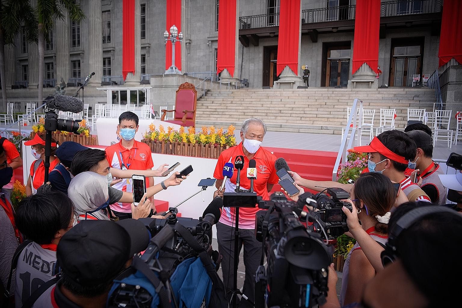 Defence Minister Ng Eng Hen speaking to the media after an NDP rehearsal at the Padang yesterday. The 150 or so spectators at this year's parade will comprise "representatives of society", he said. ST PHOTO: MARK CHEONG
