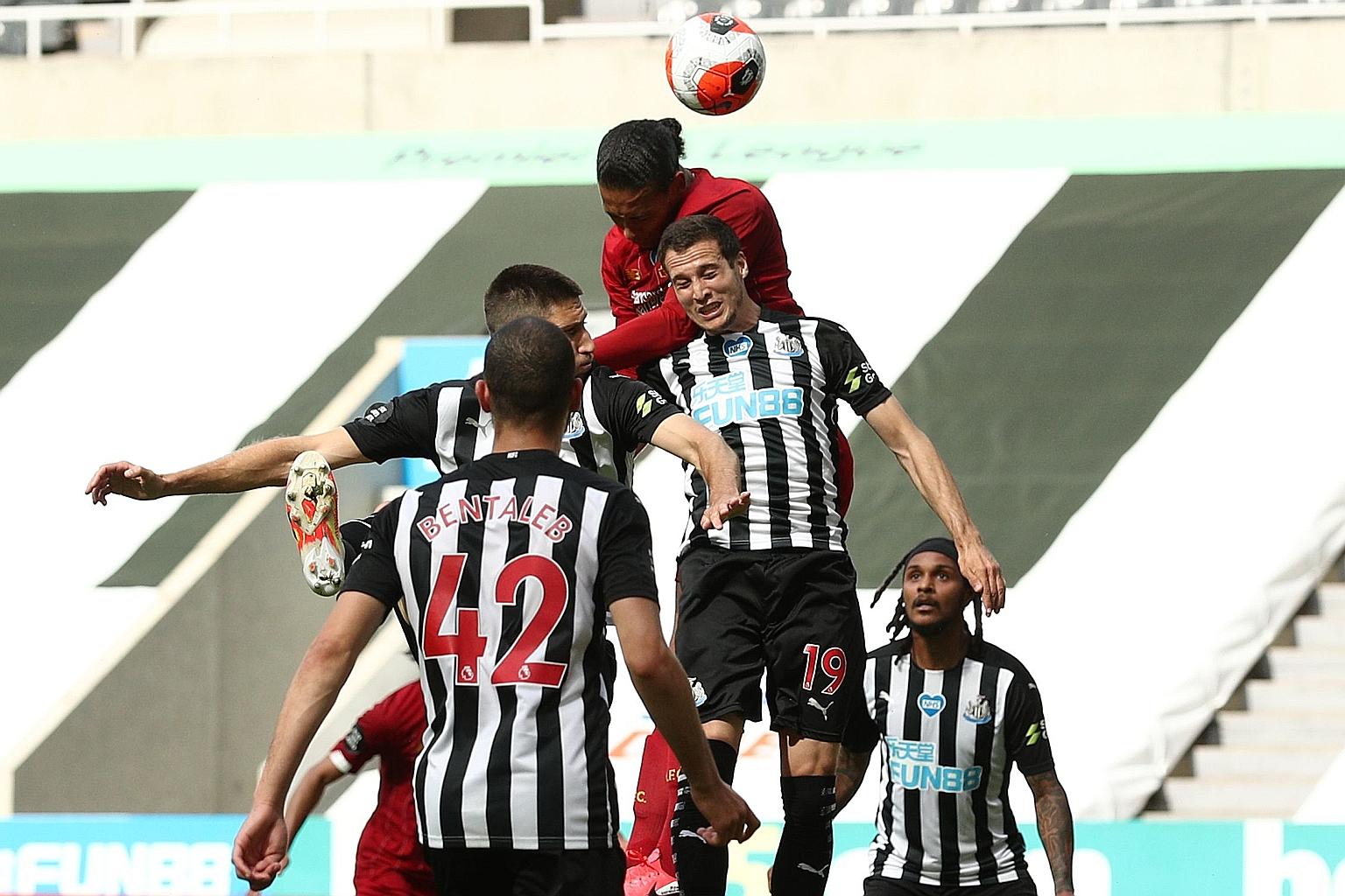 Virgil van Dijk climbing over Newcastle's Javier Manquillo to loop a header into the goal's top corner for Liverpool's equaliser. The Dutchman became the fifth outfield player to play every minute for a Premier League winning team when he started and