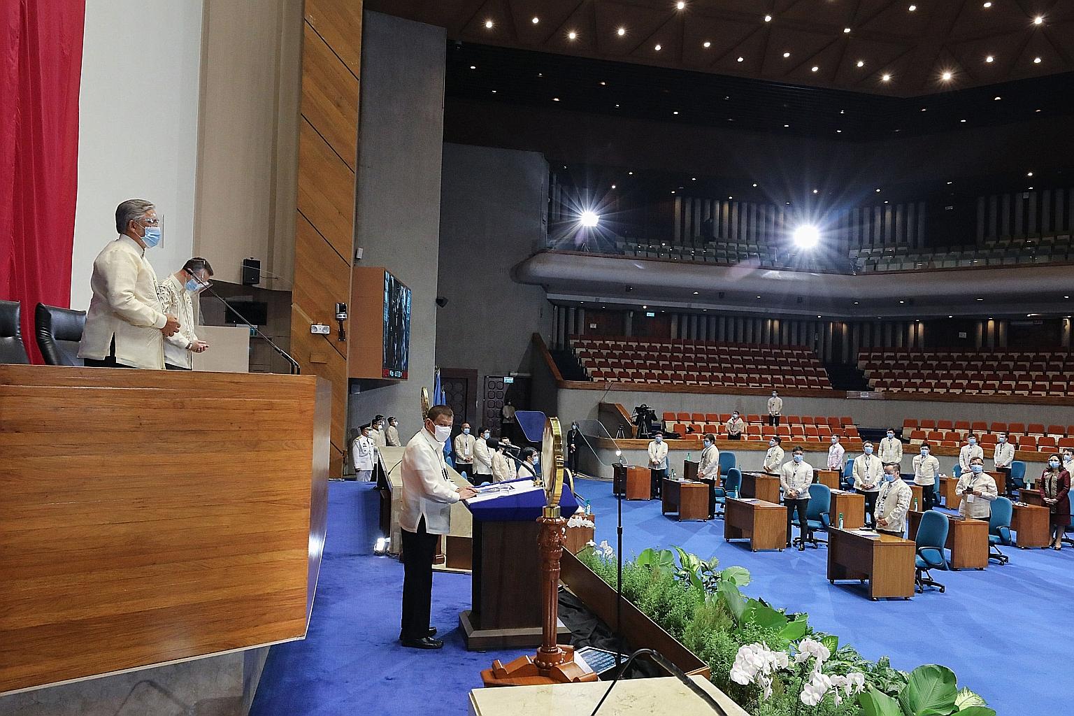Philippine President Rodrigo Duterte delivering his annual State of the Nation address in Congress in Manila yesterday. He devoted much of his speech to attacking a senator, threatening to take over the country's top telecoms and utilities firms, and