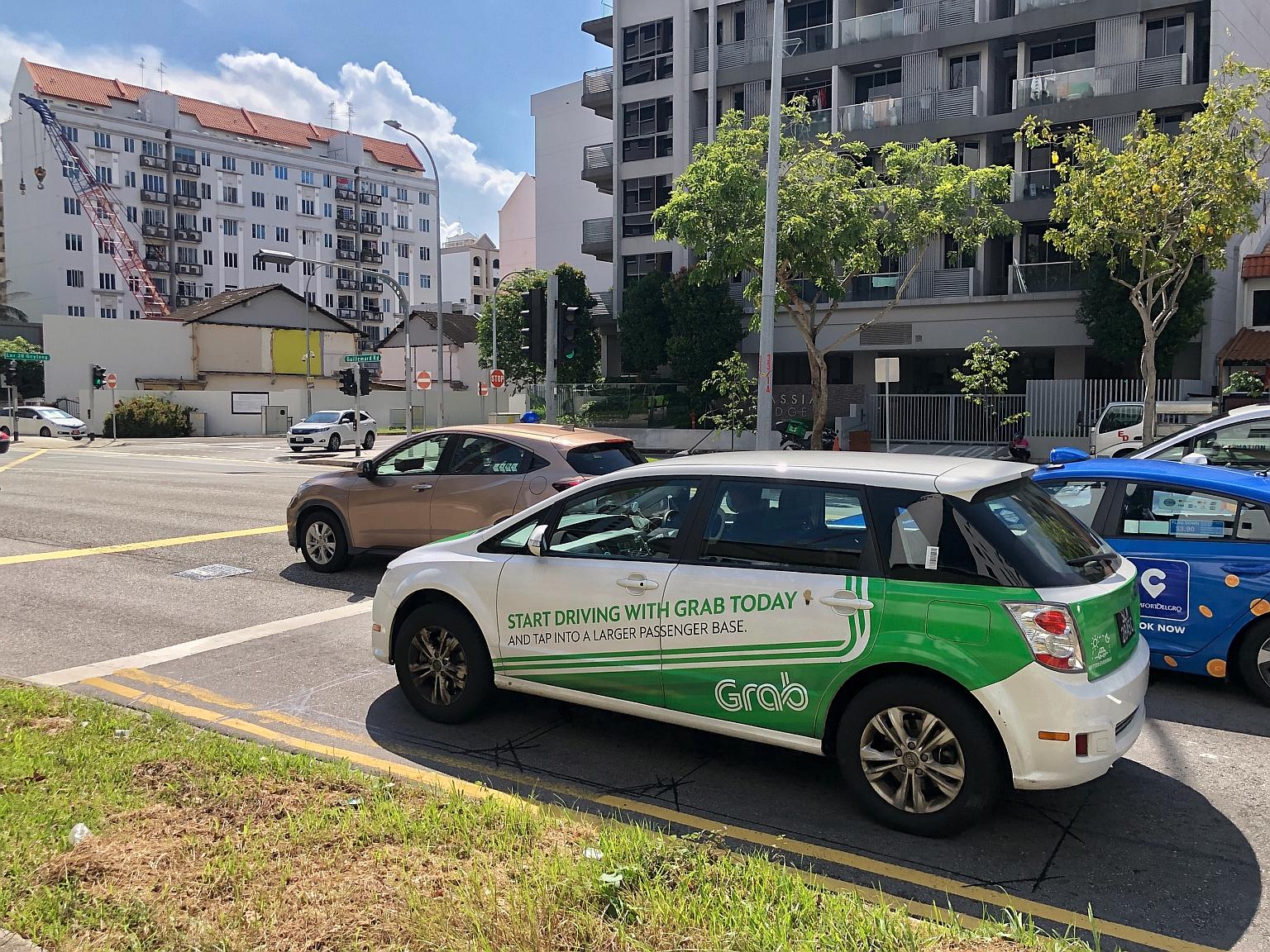 Ride-hailing firm Grab is seeking to charge passengers an extra 32 cents for each ride here. It said the "platform fee" will enable it to maintain and enhance safety measures and go towards covering operating costs. ST FILE PHOTO