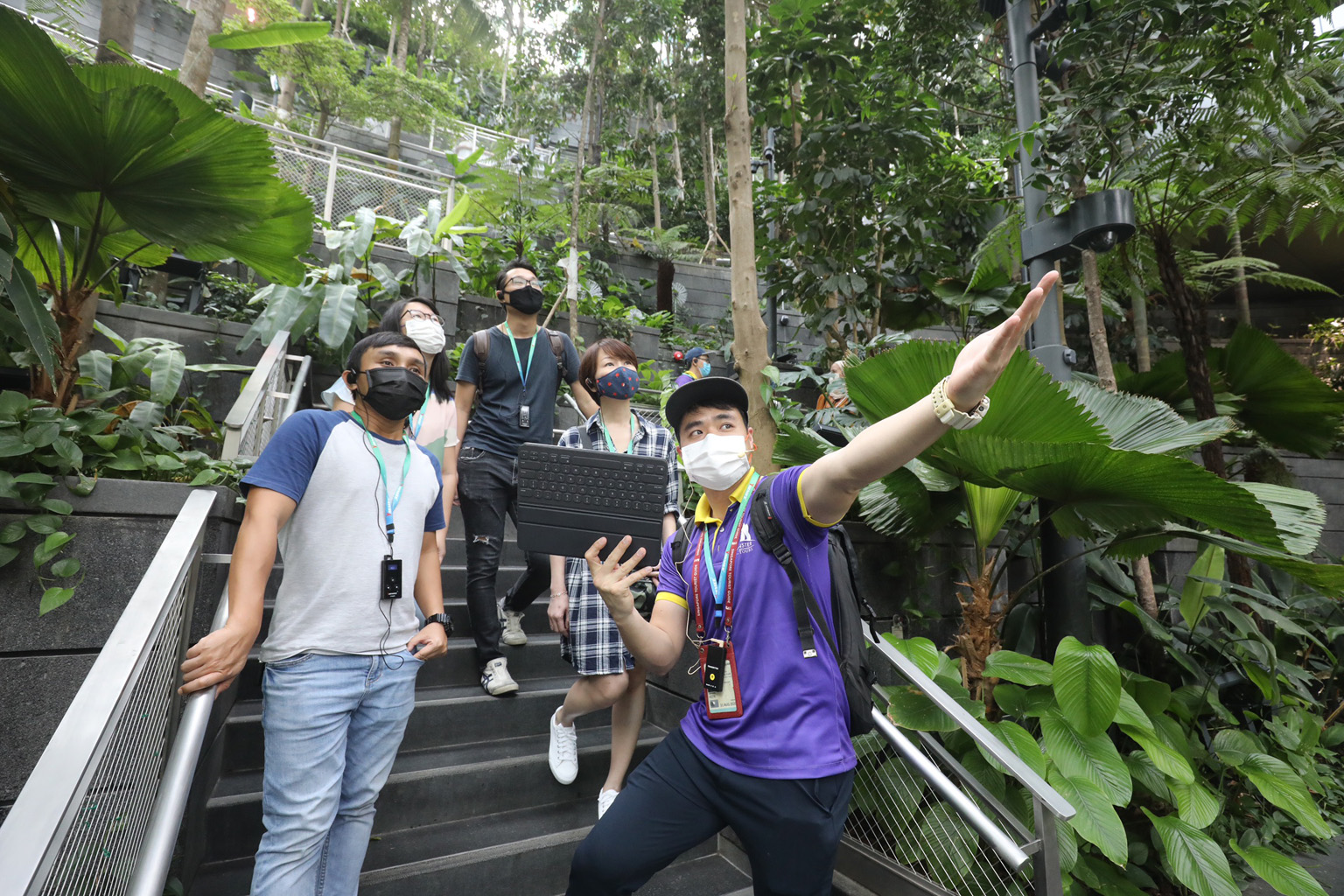 A guide from Monster Day Tours leading a tour of Jewel Changi Airport. It is one of the company's SG55 tours - so branded in line with the Singapore focus and National Day celebrations - targeting locals during the tourist drought. PHOTO: LIANHE ZAOB