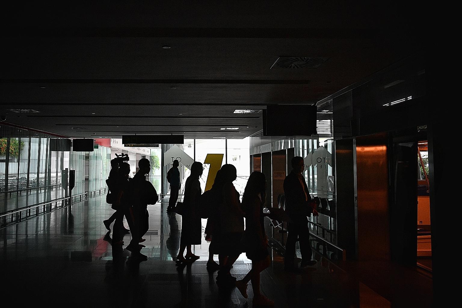People boarding a skytrain at Changi Airport on July 1. Singapore recorded a total of 688 imported cases as of Tuesday. ST PHOTO: ARIFFIN JAMAR