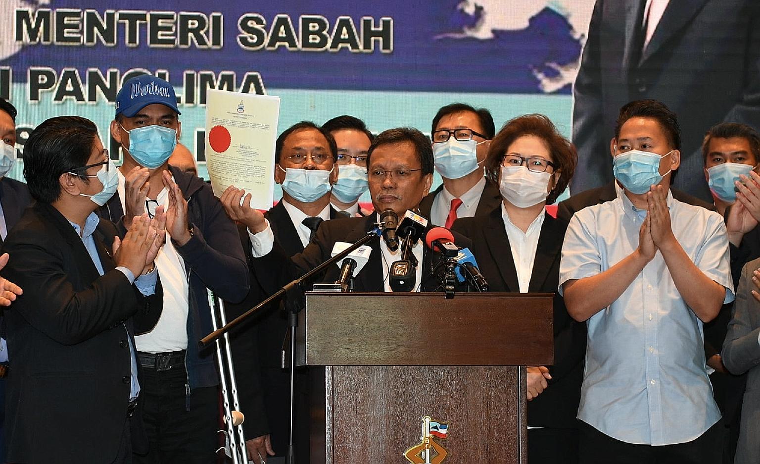 Sabah Chief Minister Shafie Apdal holding up the letter of dissolution of the state legislative assembly yesterday. An election has to take place within 60 days of the dissolution, and Datuk Seri Shafie will remain the caretaker chief until the polls