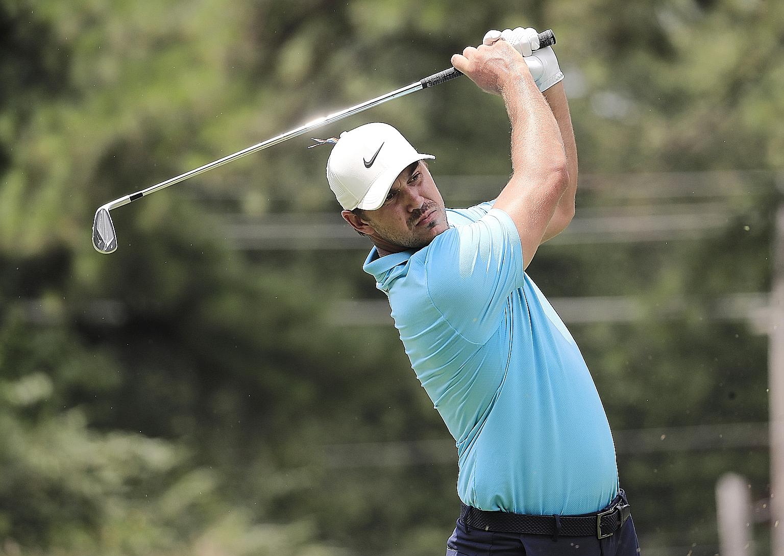 American golfer Brooks Koepka hitting his tee shot on the fourth hole during the first round of the WGC-FedEx St Jude Invitational in Memphis on Thursday. He matched his career-low round of 62 on the PGA Tour.