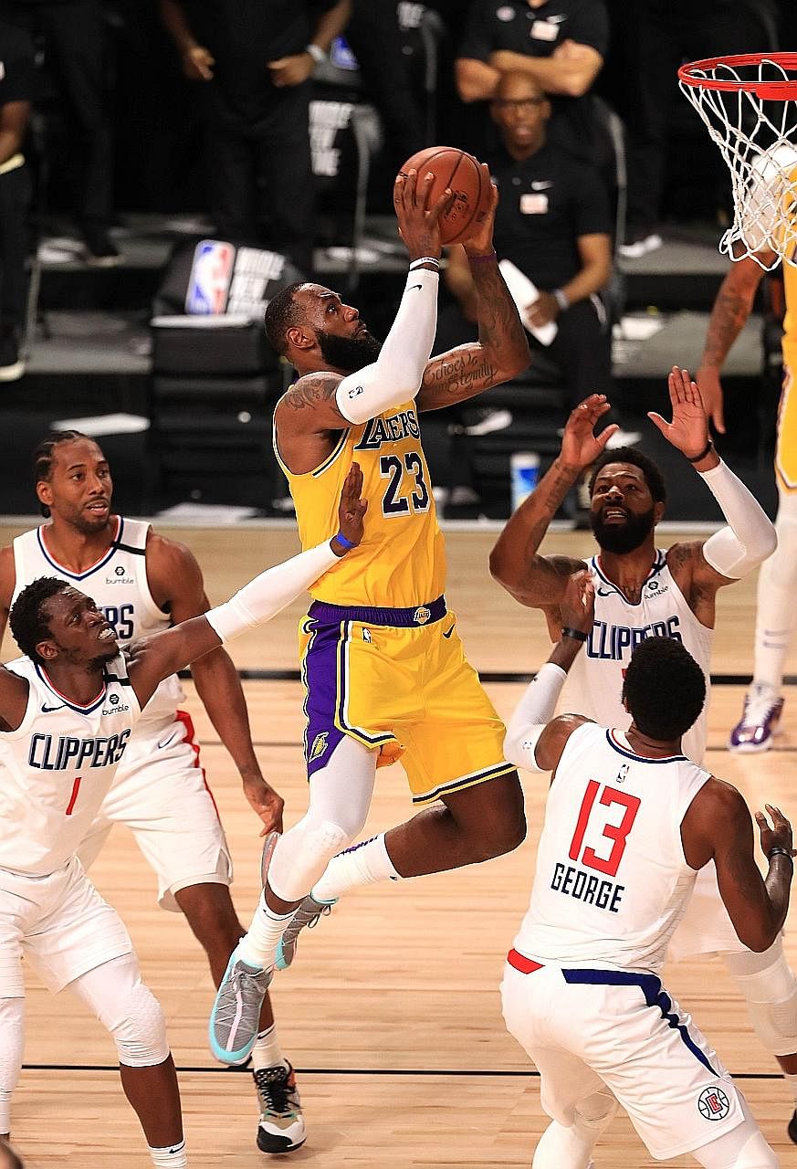 LeBron James going for a basket against the LA Clippers on Thursday. He netted the winning shot with 12.8sec left in the the Lakers' 103-101 NBA victory and they need one win to seal the top seeding in the West.