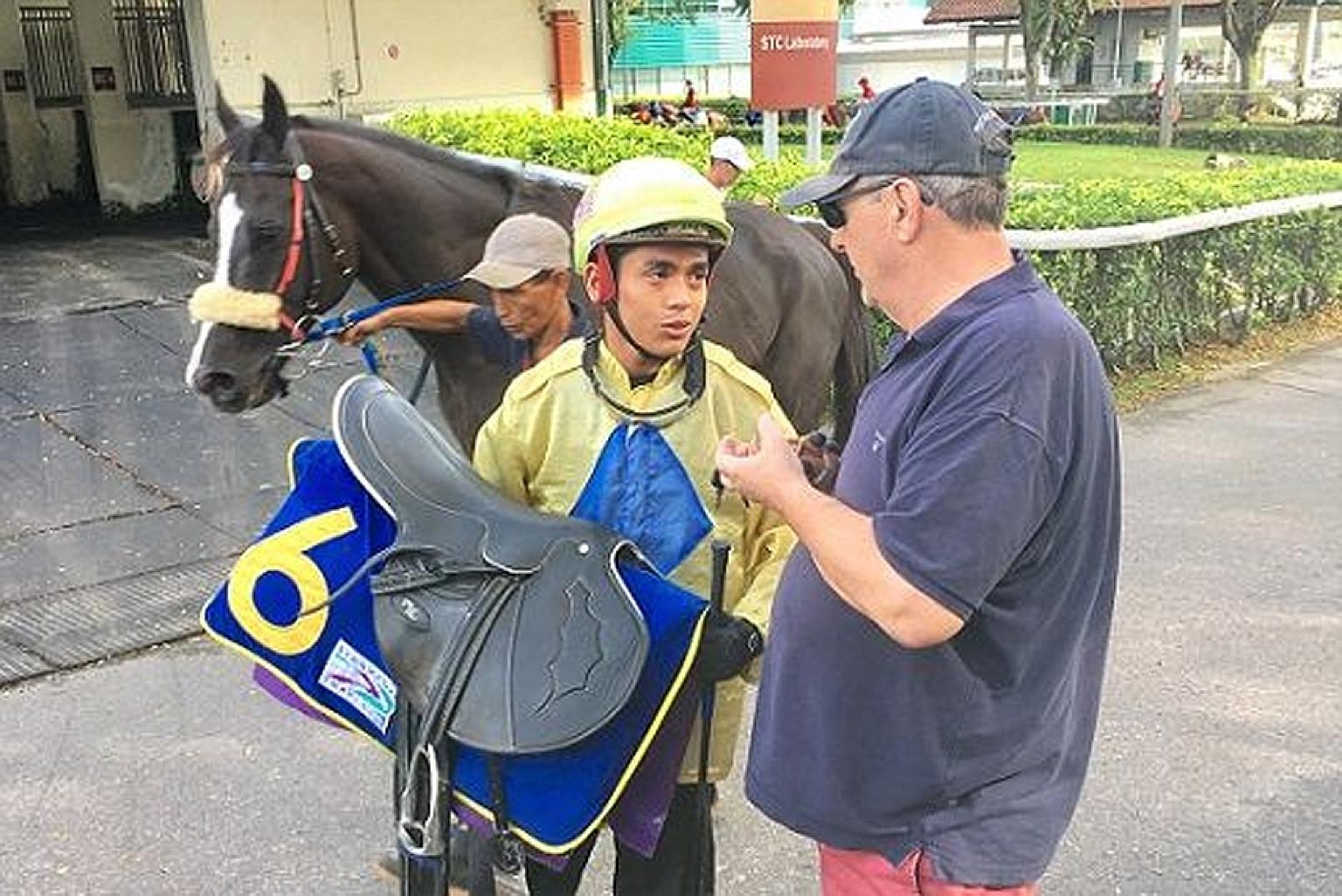 Apprentice jockey Iskandar Rosman with his master, trainer Lee Freedman, before the Covid-19 pandemic.