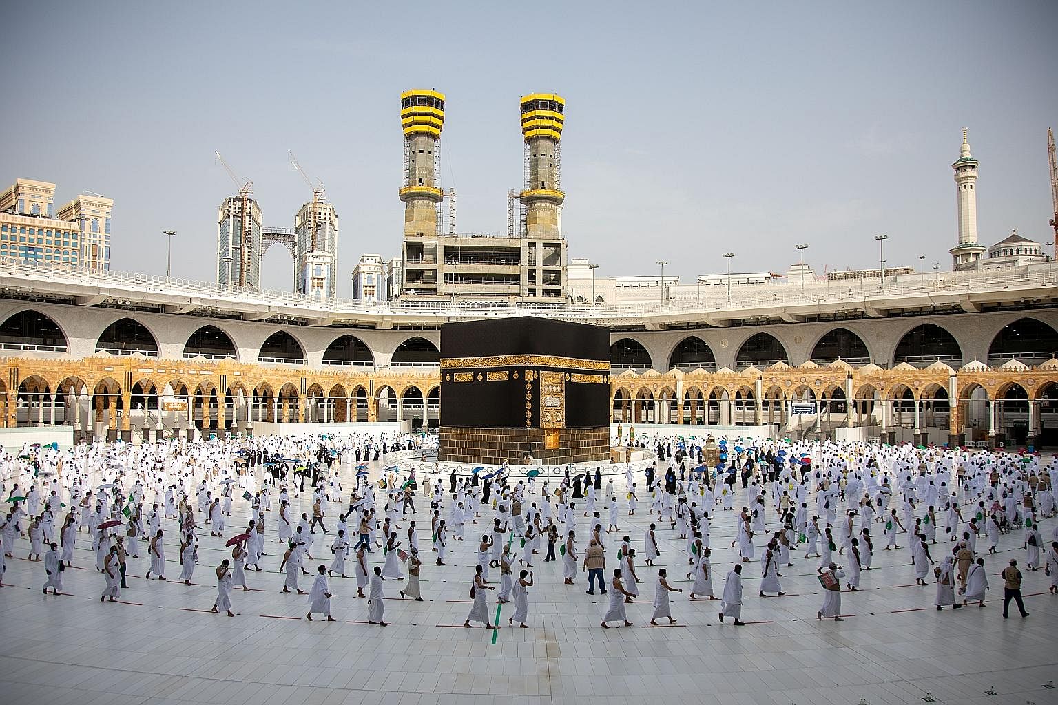 Pilgrims performing the Tawaf, or circling of the Kaaba, which is the focal point of Islam, during the annual haj pilgrimage amid the Covid-19 pandemic, in the holy city of Mecca in Saudi Arabia yesterday. The haj sees one of the world's largest reli