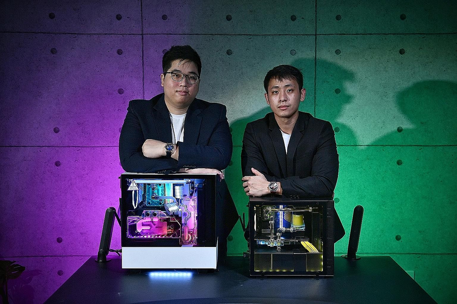 Marcus (right) and Joe (second from left, back) at one of their first IT shows. Aftershock gaming laptops have won a slew of awards from publications and websites, including The Straits Times and Hardware Zone. Fraternal twins Marcus (left) and Joe W