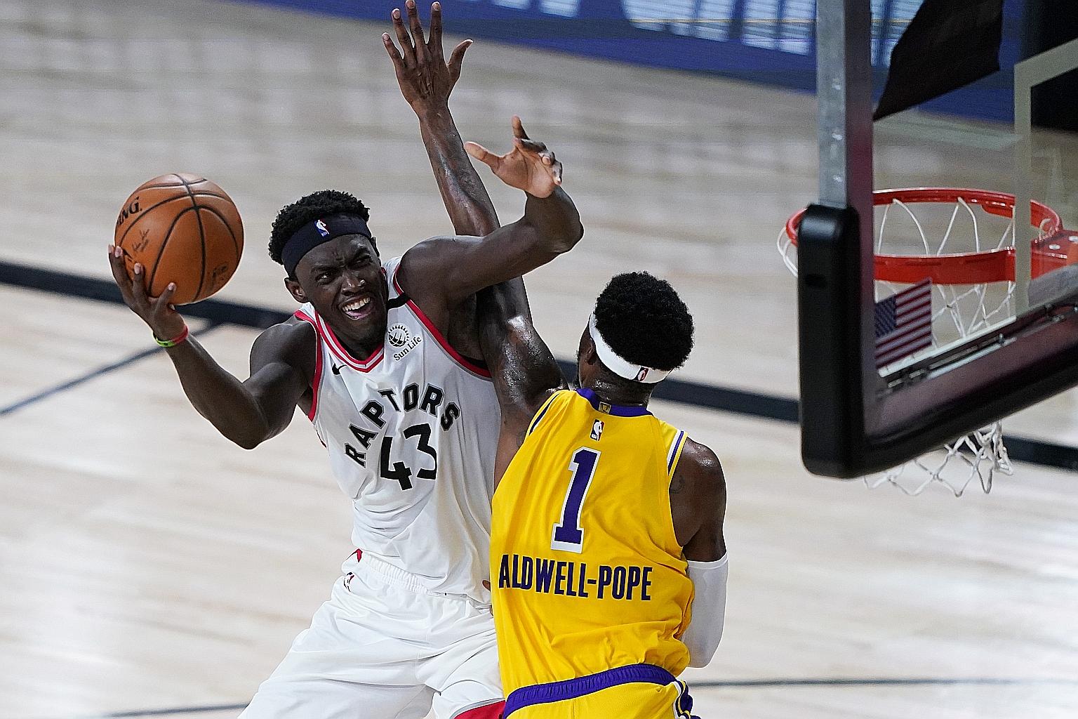 Toronto Raptors forward Pascal Siakam's attempt is thwarted by Los Angeles Lakers guard Kentavious Caldwell-Pope on Saturday. The Canadian defending champions showed that they were more than a match for the Western Conference leaders, holding them to