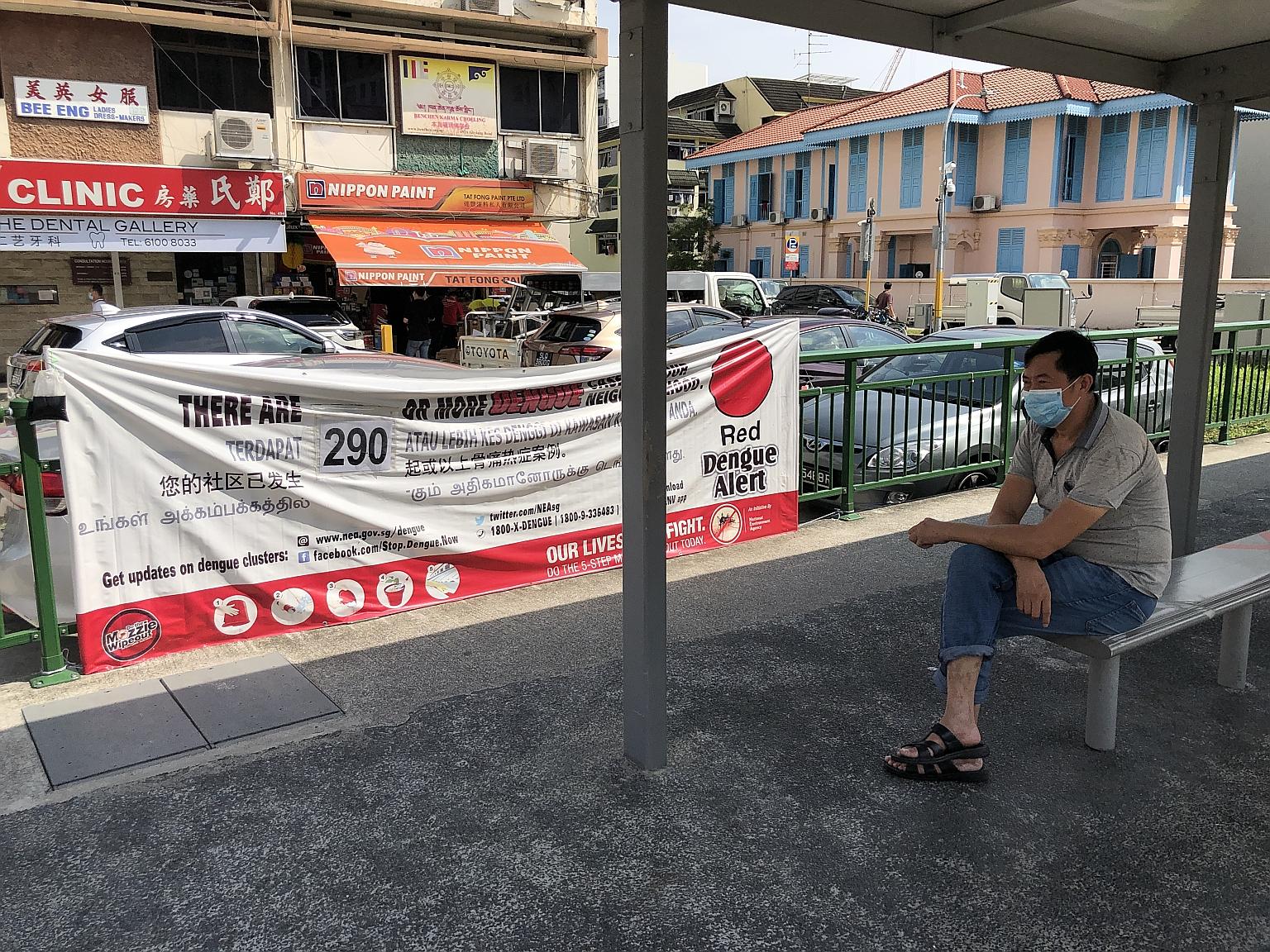 A red alert dengue banner at a bus stop in Geylang Road. The National Environment Agency has warned that even though dengue cases fell by more than 20 per cent last week, weekly numbers remain high. Singapore is in the midst of the traditional dengue