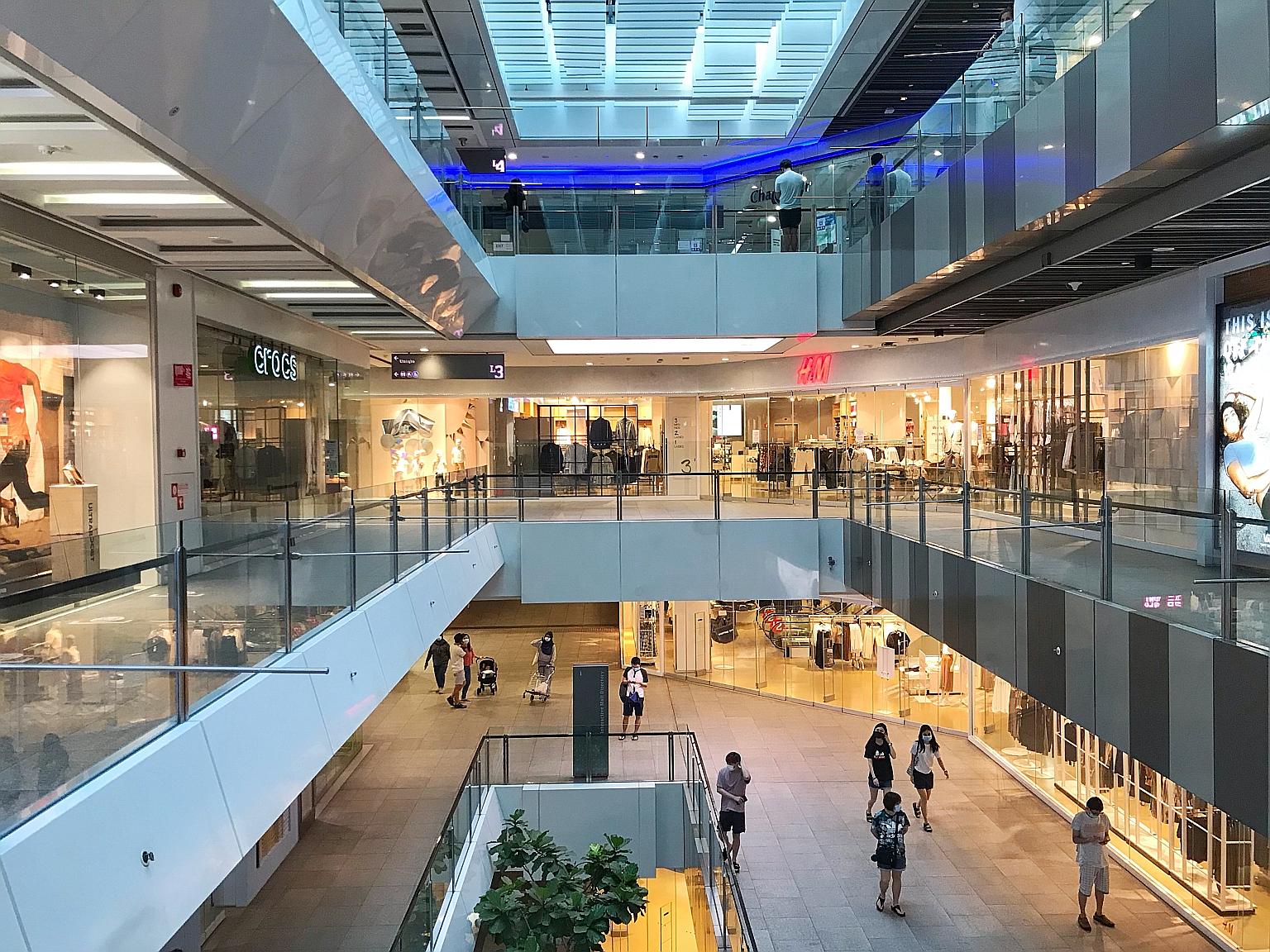 Shoppers at Jem mall in Jurong East in June after the Covid-19 circuit breaker ended. While the Singapore economy is expected to bounce back starting in the second half of this year, service sectors will likely continue suffering until a virus vaccin