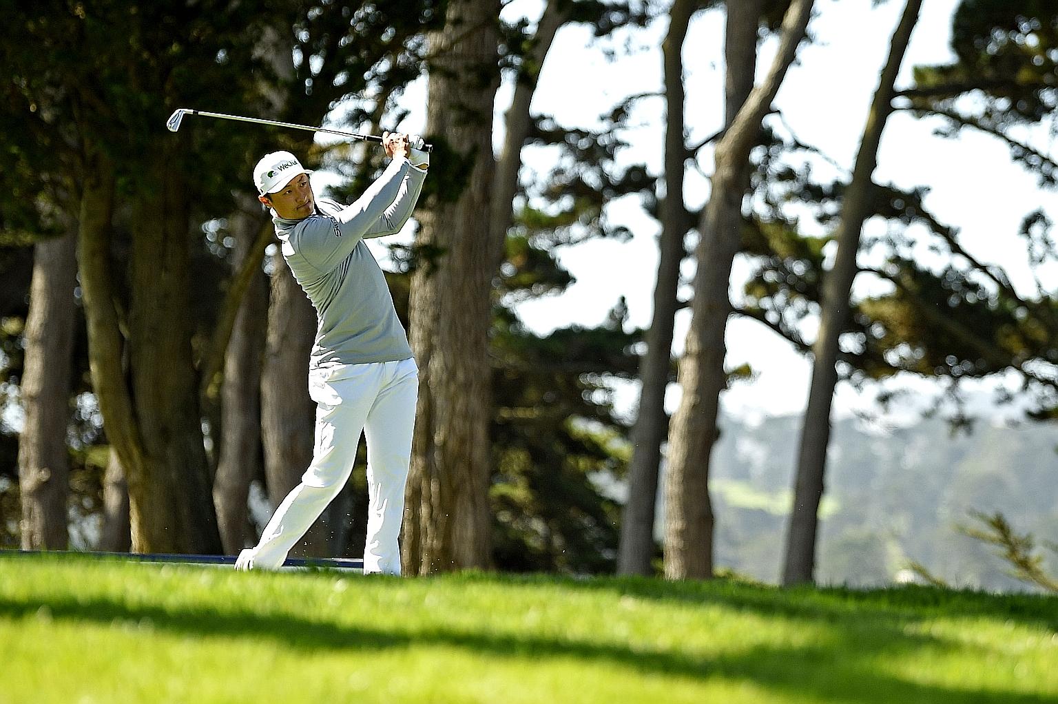 China's Li Haotong playing his shot from the 15th tee in the second round of the PGA Championship at TPC Harding Park on Friday. He took the lead with a five-under 65 for the day and an eight-under 132 halfway total.