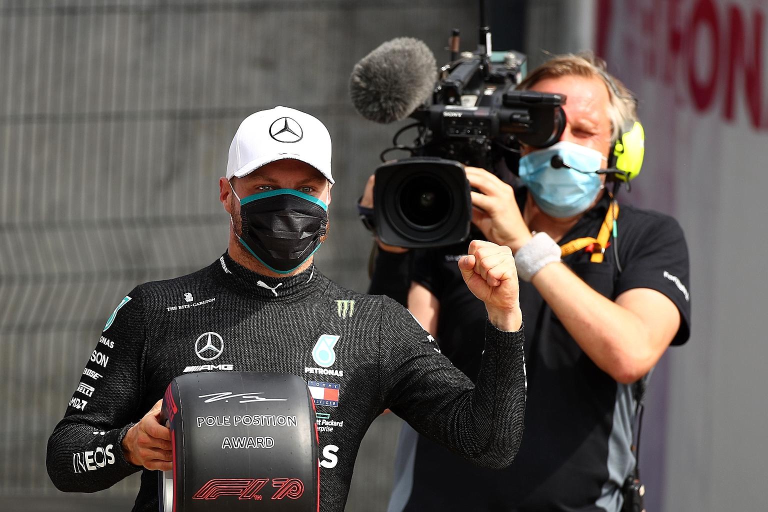 An ecstatic Valtteri Bottas in the pit lane after securing pole position in yesterday's qualifying session at Silverstone.