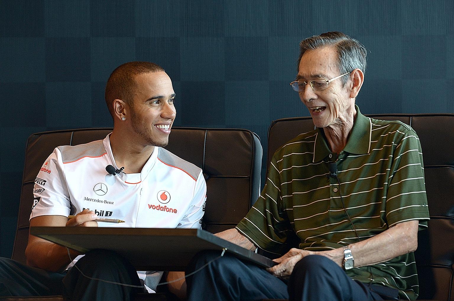 Then McLaren driver Lewis Hamilton signing a poster for Rodney Seow when they met at a Johnnie Walker event before the F1 Singapore Grand Prix in 2012.