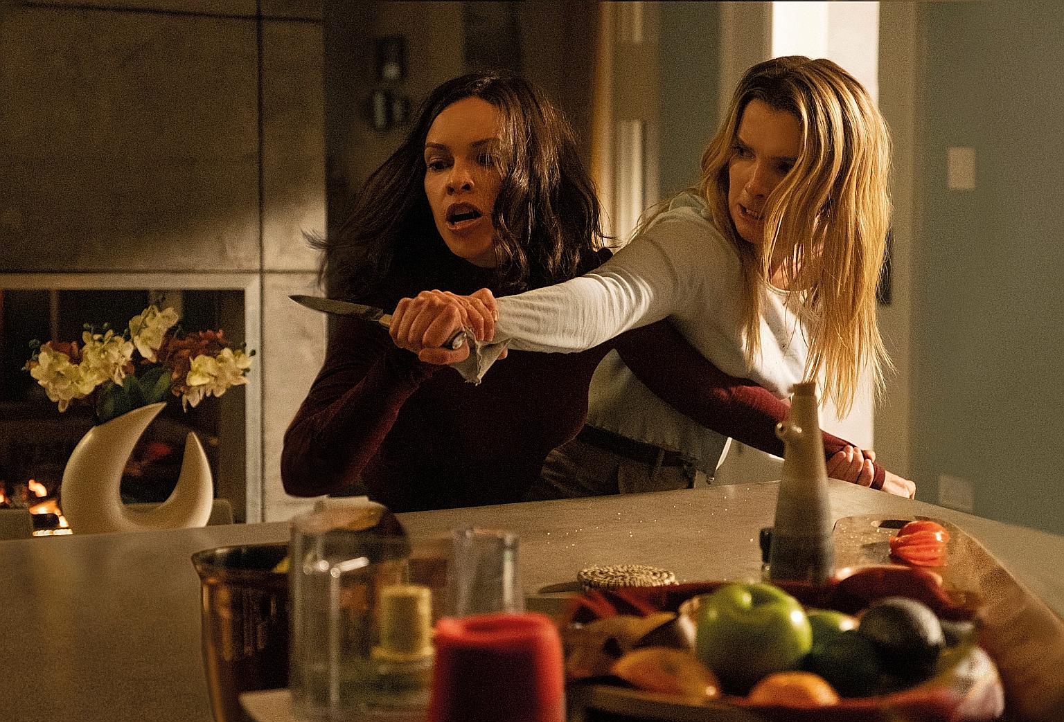 The Hunt stars Hilary Swank (left) and Betty Gilpin (right).