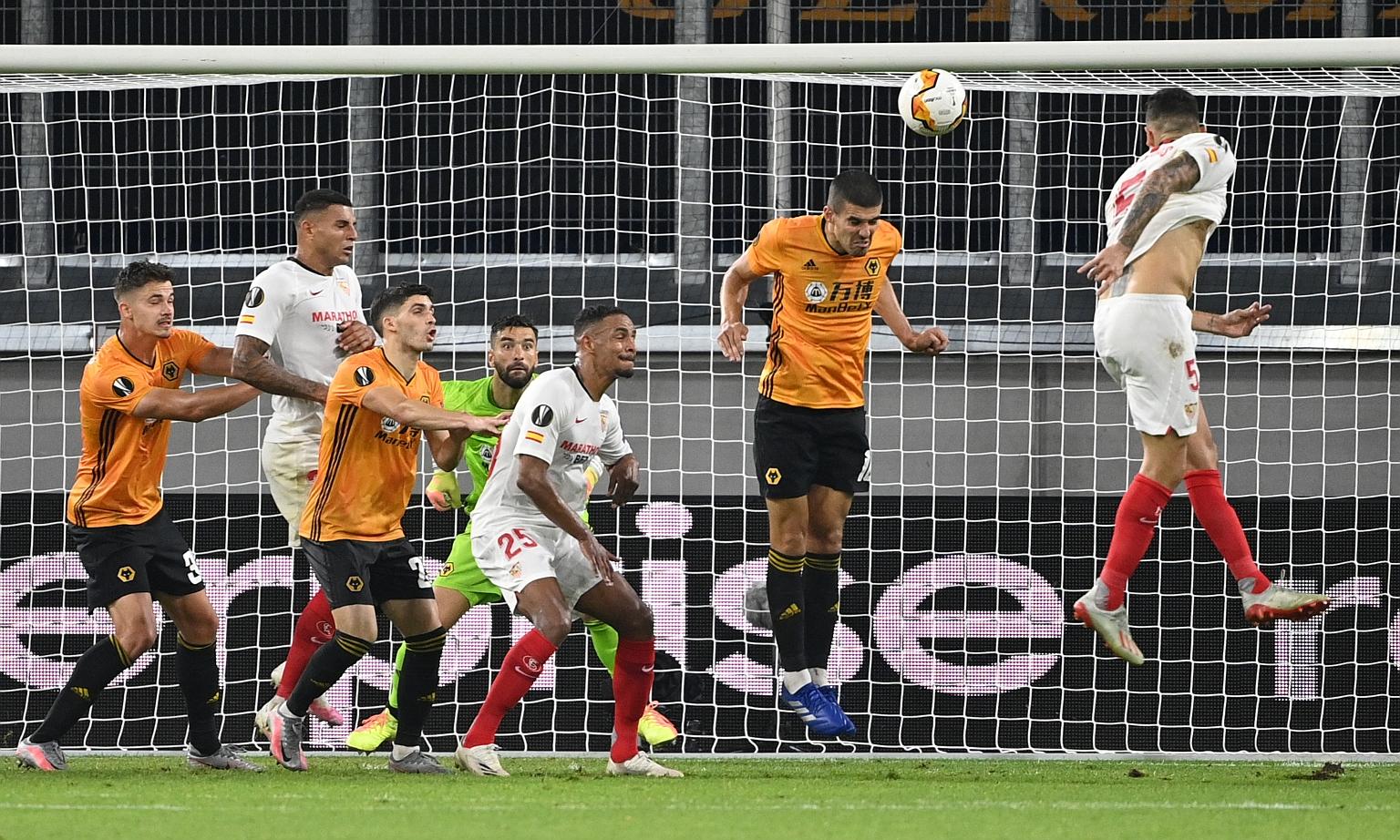 Lucas Ocampos heading in the only goal of the game against Wolves for five-time Europa League champions Sevilla to reach the semi-finals, where they will meet Manchester United on Sunday.
