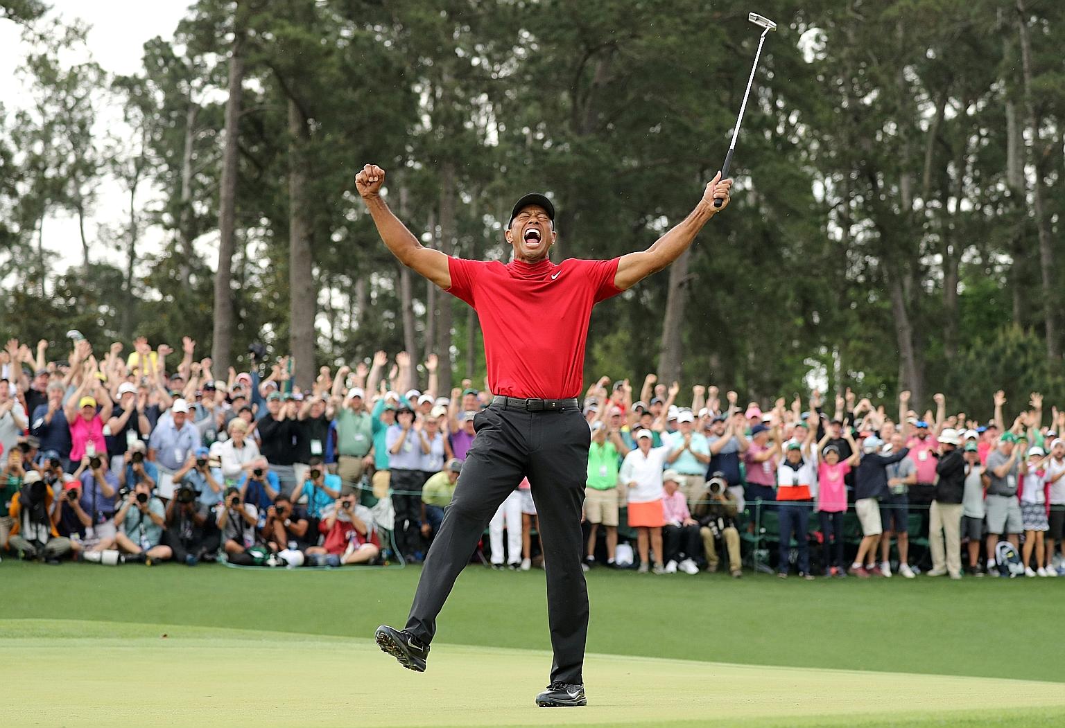 Huge crowds were on hand to cheer Tiger Woods as he celebrated last year's Masters win. Fans will be barred from this year's delayed edition in November due to Covid-19.