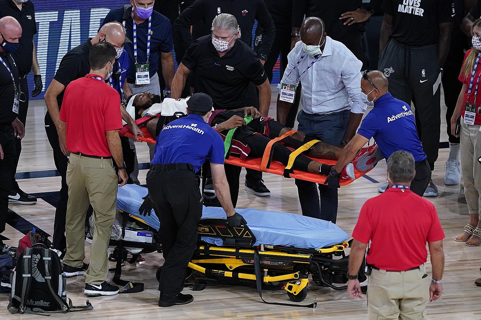 Miami's Derrick Jones Jr was stretchered off in the third quarter after he crashed into Indiana's 2.11m, 113kg Georgian centre Goga Bitadze in Friday's NBA game.