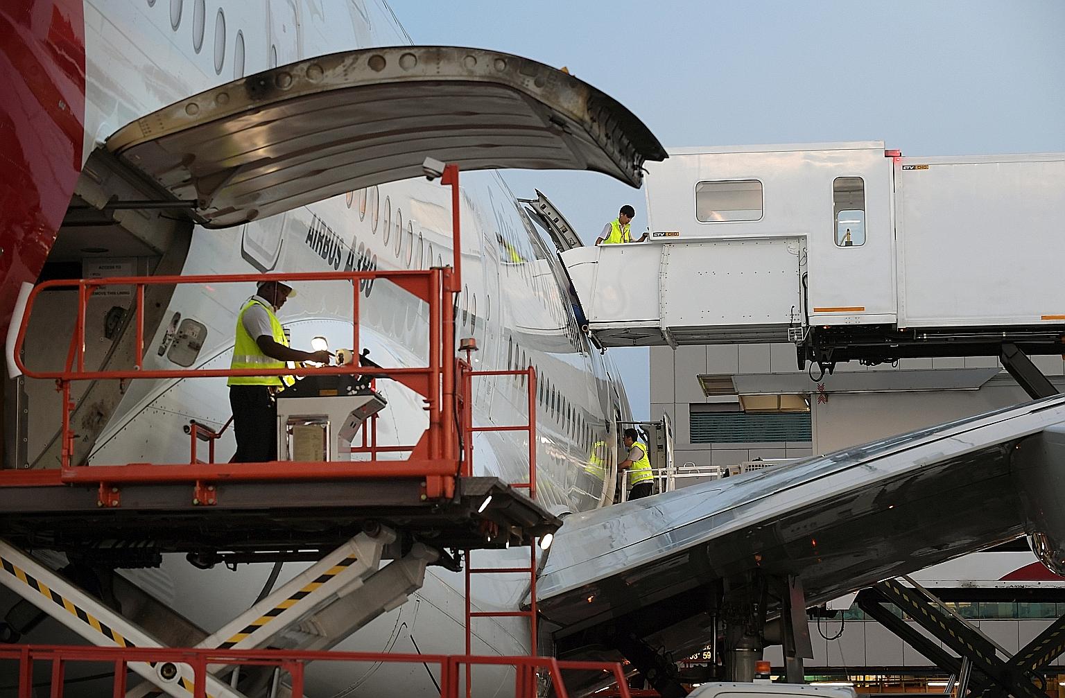 For workers in the aviation sector who cannot work now, the Government has been helping to redeploy them to other areas where their skills are valued, such as aircrew being redeployed to hospitals as care ambassadors. ST FILE PHOTO