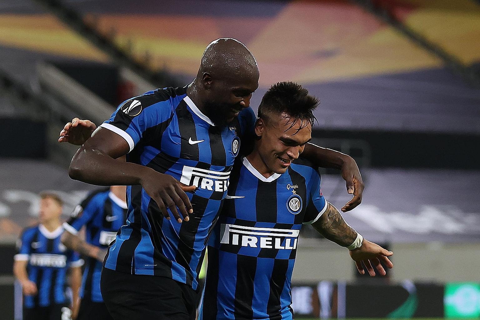 Inter Milan's forward Romelu Lukaku (left) celebrates with Lautaro Martinez after scoring the fourth goal against Shakhtar Donetsk in the Europa League semi-final. They will face Sevilla in the final.
