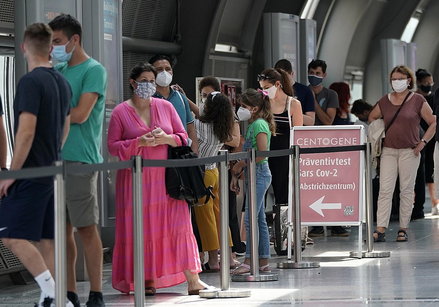 Passengers queueing at a test centre for returnees at Frankfurt airport on Sunday. Across Europe, officials are tightening movement restrictions to prevent summer partying and travel from spreading the virus.