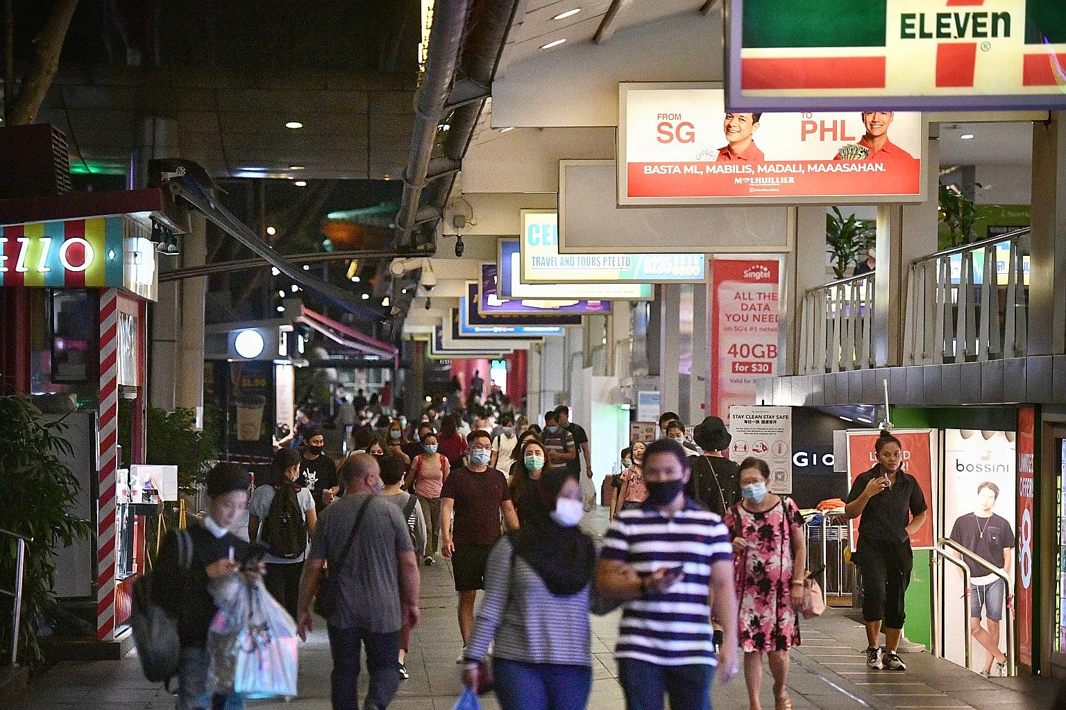 People outside Lucky Plaza yesterday. From Aug 29, those with an even last digit on their identification cards can visit Lucky Plaza and Peninsula Plaza only on even dates during weekends, while those with an odd last digit can visit only on odd date