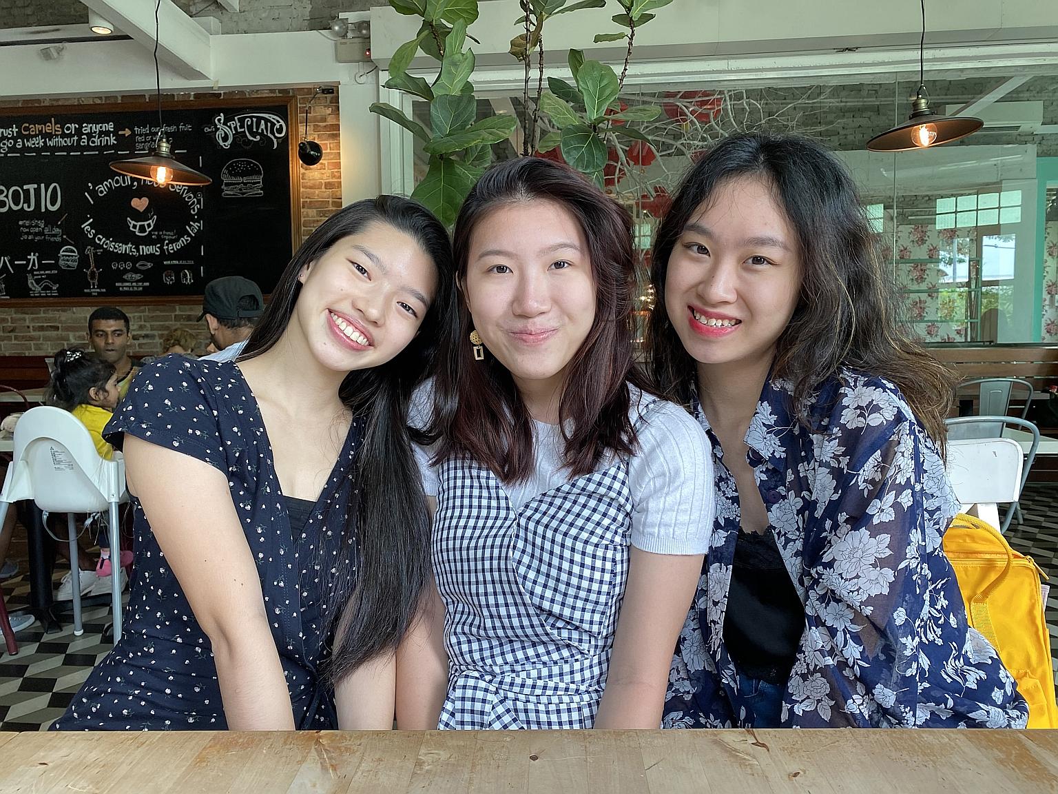 Ms Rachel Han (left) and Ms Rachel Lee (right) are founders of Package Pals, an initiative that collects single-use packaging and distributes it to retailers for reuse. With them is core team member Puan Xin.